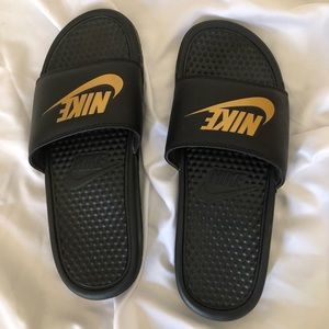 Black and gold women Nike slides size 8